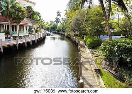 Buildings along a canal View Large Photo Image Stock Photography - Buildings along a canal. Fotosearch