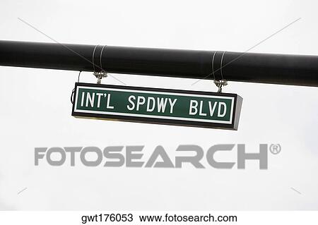 Stock Image - Close-up of a signboard hanging on a wall. Fotosearch