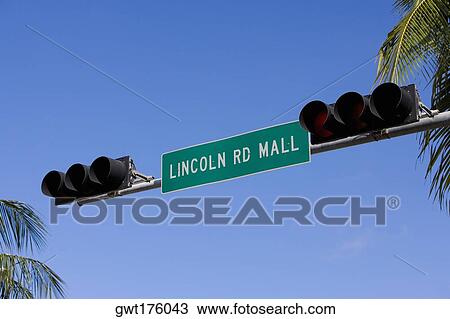 Low angle view of a signboard between two traffic lights, South Beach, Miami Beach, Florida, USA View Large Photo Image Stock Image - Low angle view of a signboard between two traffic lights, South Beach, Miami Beach, Florida, USA. Fotosearch