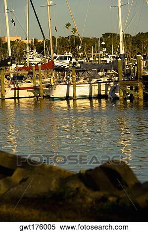 Reflection of boats in water, Cocoa Beach, Florida, USA View Large Photo Image Stock Photography - Reflection of boats in water, Cocoa Beach, Florida, USA. Fotosearch