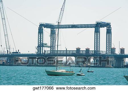 Boat in front of a bridge, Bridge Of Lions, Matanzas Bay, St Augustine, Florida, USA View Large Photo Image Stock Photograph - Boat in front of a bridge, Bridge Of Lions, Matanzas Bay, St Augustine, Florida, USA. Fotosearch