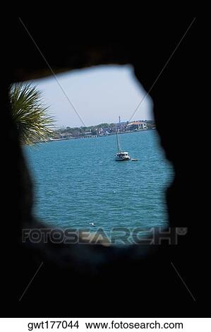 Boat viewed through a hole, Matanzas Bay, St. Augustine, Florida, USA View Large Photo Image Picture - Boat viewed through a hole, Matanzas Bay, St. Augustine, Florida, USA. Fotosearch