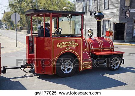 Engine of a vehicle in front of a building, St. Augustine, Florida, USA View Large Photo Image Stock Photography - Engine of a vehicle in front of a building, St. Augustine, Florida, USA. Fotosearch