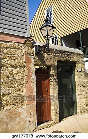 Lantern mounted on the wall of a house View Large Photo Image Stock Photo - Lantern mounted on the wall of a house. Fotosearch