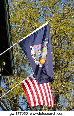 Low angle view of US state flag with the National flag View Large Photo Image Stock Image - Low angle view of US state flag with the National flag. Fotosearch