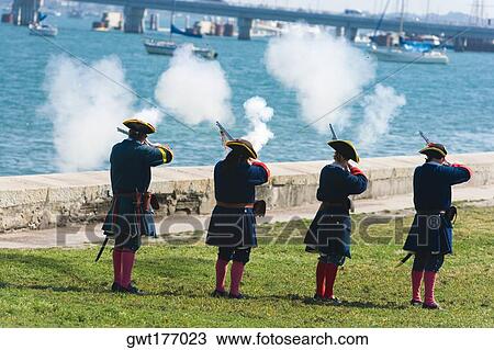 Rear view of four people shooting rifles, St. Augustine, Florida, USA View Large Photo Image Stock Image - Rear view of four people shooting rifles, St. Augustine, Florida, USA. Fotosearch