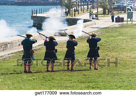 Rear view of four people shooting rifles, St. Augustine, Florida, USA View Large Photo Image Stock Photo - Rear view of four people shooting rifles, St. Augustine, Florida, USA. Fotosearch