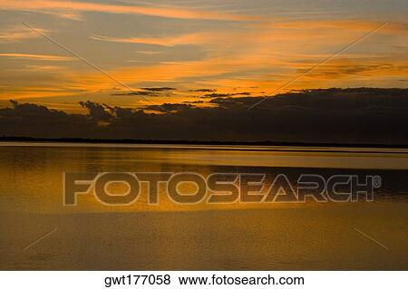 Stock Photo - Reflection of clouds in water, St. Augustine Beach, Florida, USA. Fotosearch