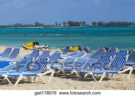 Beach chairs and jet boats on the beach, Cable Beach, Nassau, Bahamas View Large Photo Image Stock Photograph - Beach chairs and jet boats on the beach, Cable Beach, Nassau, Bahamas. Fotosearch