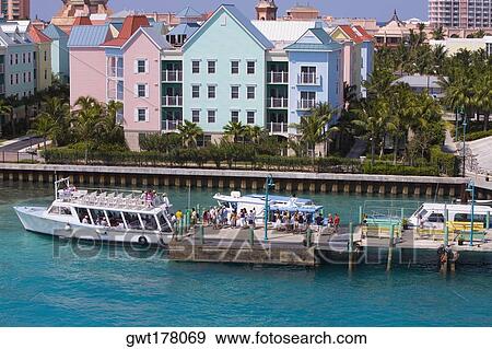 High angle view a group of people waiting to enter the tourboats, Paradise Island, Bahamas View Large Photo Image Stock Photo - High angle view a group of people waiting to enter the tourboats, Paradise Island, Bahamas. Fotosearch
