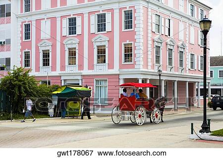 Horse cart moving on the road, Bay Street, Nassau, Bahamas View Large Photo Image Stock Photo - Horse cart moving on the road, Bay Street, Nassau, Bahamas. Fotosearch