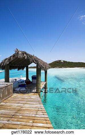 Thatched roof on a pier, Exuma, Bahamas View Large Photo Image Stock Image - Thatched roof on a pier, Exuma, Bahamas. Fotosearch