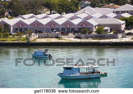 Tourboats in water in front of buildings, Paradise Island, Bahamas View Large Photo Image Stock Photo - Tourboats in water in front of buildings, Paradise Island, Bahamas. Fotosearch