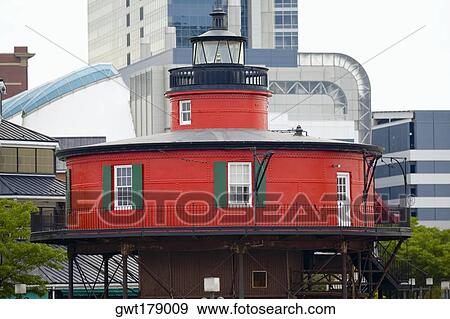 Lighthouse in front of buildings, Seven Foot Knoll Lighthouse, Inner Harbor, Baltimore, Maryland, USA View Large Photo Image Stock Photo - Lighthouse in front of buildings, Seven Foot Knoll Lighthouse, Inner Harbor, Baltimore, Maryland, USA. Fotosearch