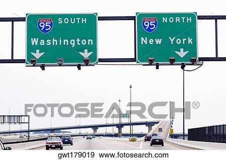 Low angle view of road signboards over the road, Baltimore, Maryland, USA View Large Photo Image Stock Photo - Low angle view of road signboards over the road, Baltimore, Maryland, USA. Fotosearch