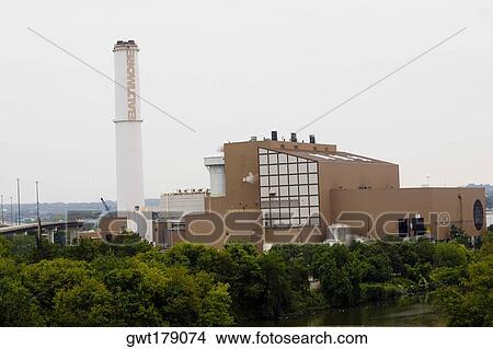 Trees in front of a factory, Baltimore, Maryland, USA View Large Photo Image Picture - Trees in front of a factory, Baltimore, Maryland, USA. Fotosearch
