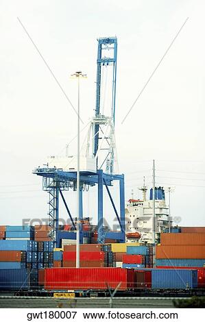 Cargo containers and a crane at a commercial dock, Charleston, South Carolina, USA View Large Photo Image Stock Photo - Cargo containers and a crane at a commercial dock, Charleston, South Carolina, USA. Fotosearch