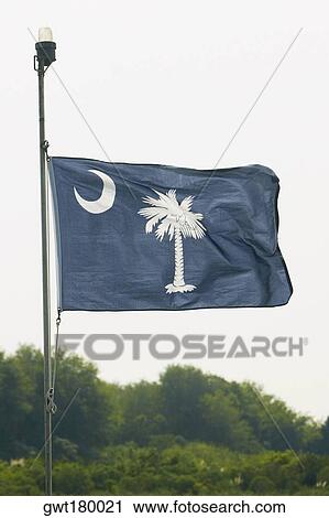 Low angle view of a flag fluttering, Patriot's Point, Charleston Harbor, Charleston, South Carolina, USA View Large Photo Image Stock Image - Low angle view of a flag fluttering, Patriot's Point, Charleston Harbor, Charleston, South Carolina, USA. Fotosearch