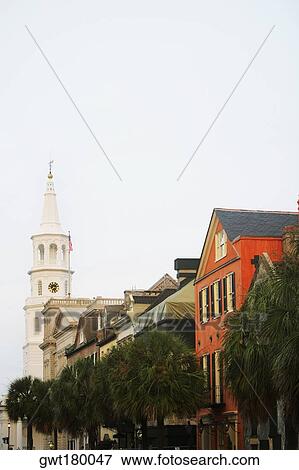 Stock Photo - Low angle view of buildings and a church, St. John's Lutheran Church, Charleston, South Carolina, USA. Fotosearch