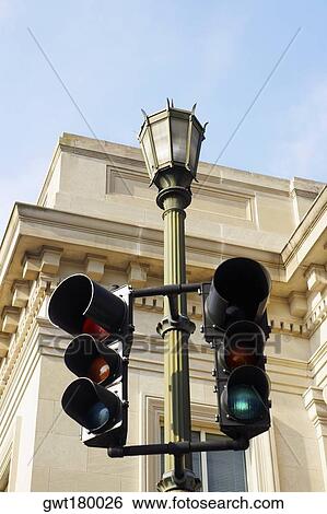 Low angle view of traffic lights on a lamppost with buildings in the background, Charleston, South Carolina, USA View Large Photo Image Stock Photograph - Low angle view of traffic lights on a lamppost with buildings in the background, Charleston, South Carolina, USA. Fotosearch