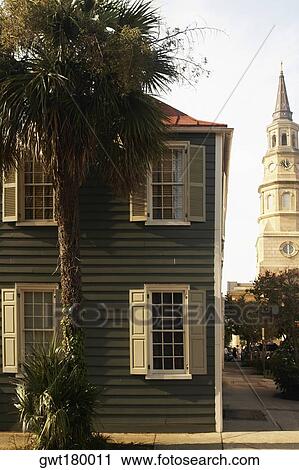 Palm tree in front of a building with a church in the background, St. Philip's Church, Charleston, South Carolina, USA View Large Photo Image Stock Image - Palm tree in front of a building with a church in the background, St. Philip's Church, Charleston, South Carolina, USA. Fotosearch