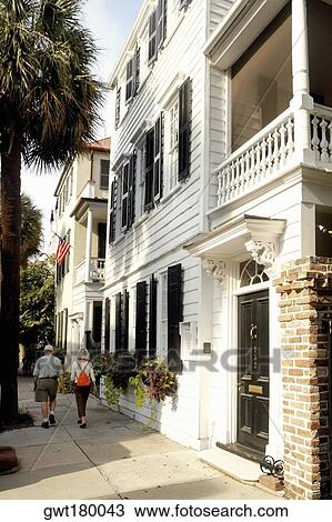Rear view of a man and a woman walking on the street, Charleston, South Carolina, USA View Large Photo Image Stock Image - Rear view of a man and a woman walking on the street, Charleston, South Carolina, USA. Fotosearch