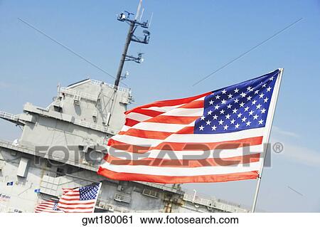 Row of American flags fluttering in front of a military ship, Patriot's Point, Charleston Harbor, Charleston, South Carolina, USA View Large Photo Image Stock Image - Row of American flags fluttering in front of a military ship, Patriot's Point, Charleston Harbor, Charleston, South Carolina, USA. Fotosearch