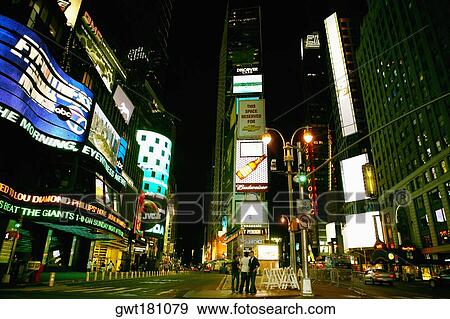 Buildings lit up at night in a city, Times Square, Manhattan, New York City, New York State, USA View Large Photo Image Stock Photo - Buildings lit up at night in a city, Times Square, Manhattan, New York City, New York State, USA. Fotosearch
