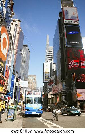Bus on a road, Times Square, Manhattan, New York City, New York State, USA View Large Photo Image Stock Photo - Bus on a road, Times Square, Manhattan, New York City, New York State, USA. Fotosearch