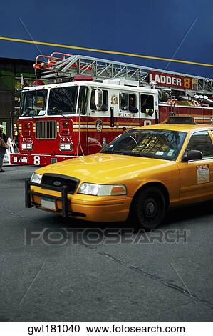 Fire engine and a yellow taxi on a road, New York City, New York State, USA View Large Photo Image Stock Image - Fire engine and a yellow taxi on a road, New York City, New York State, USA. Fotosearch