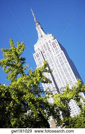 Low angle view of a building, Empire State Building, Manhattan, New York City, New York State, USA View Large Photo Image Stock Photo - Low angle view of a building, Empire State Building, Manhattan, New York City, New York State, USA. Fotosearch