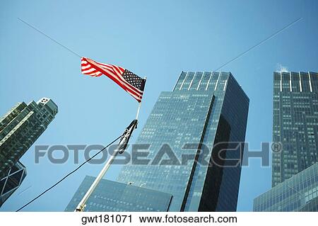 Low angle view of an American flag in front of buildings, World Trade Center, Manhattan, New York City, New York State, USA View Large Photo Image Stock Image - Low angle view of an American flag in front of buildings, World Trade Center, Manhattan, New York City, New York State, USA. Fotosearch