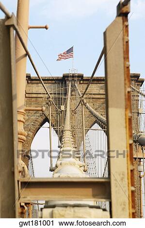Low angle view of an American flag on a bridge, Brooklyn Bridge, New York City, New York State, USA View Large Photo Image Stock Image - Low angle view of an American flag on a bridge, Brooklyn Bridge, New York City, New York State, USA. Fotosearch