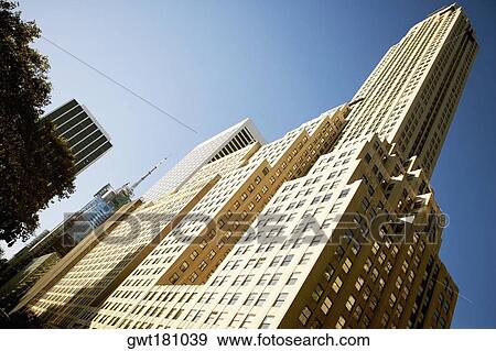 Low angle view of skyscrapers in a city, Irving Trust Company Building, Manhattan, New York City, New York State, USA View Large Photo Image Stock Photo - Low angle view of skyscrapers in a city, Irving Trust Company Building, Manhattan, New York City, New York State, USA. Fotosearch