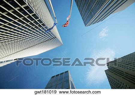 Low angle view of two flags with skyscrapers, New York City, New York State, USA View Large Photo Image Stock Photo - Low angle view of two flags with skyscrapers, New York City, New York State, USA. Fotosearch