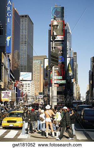 Tourists standing in front of a building in a city, Times Square, Manhattan, New York City, New York State, USA View Large Photo Image Stock Image - Tourists standing in front of a building in a city, Times Square, Manhattan, New York City, New York State, USA. Fotosearch