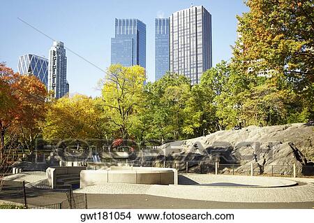 Trees in front of a building, Central Park, Manhattan, New York City, New York State, USA View Large Photo Image Picture - Trees in front of a building, Central Park, Manhattan, New York City, New York State, USA. Fotosearch