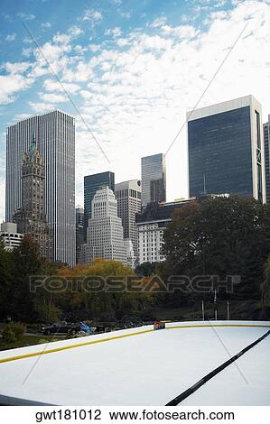 Trees in front of buildings, Central Park, Manhattan, New York City, New York State, USA View Large Photo Image Stock Image - Trees in front of buildings, Central Park, Manhattan, New York City, New York State, USA. Fotosearch