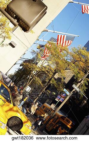American flag fluttering on a building, Fifth Avenue, Manhattan, New York City, New York State, USA View Large Photo Image Stock Photograph - American flag fluttering on a building, Fifth Avenue, Manhattan, New York City, New York State, USA. Fotosearch