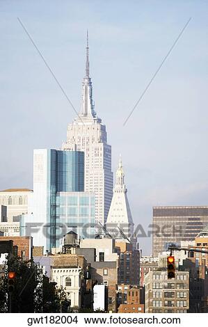 Buildings in a city, Empire State Building, Manhattan, New York City, New York State, USA View Large Photo Image Picture - Buildings in a city, Empire State Building, Manhattan, New York City, New York State, USA. Fotosearch