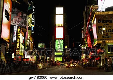 Stock Image - Buildings lit up at night in a city, Times Square, Manhattan, New York City, New York State, USA. Fotosearch