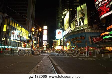 Stock Photography - Buildings lit up at night in a city, Times Square, Manhattan, New York City, New York State, USA. Fotosearch