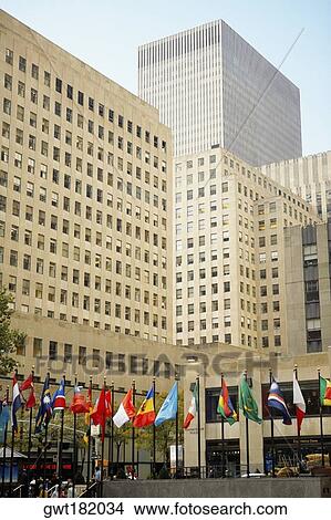 Flags in front of a building, Rockefeller Center, Manhattan, New York City, New York State, USA View Large Photo Image Picture - Flags in front of a building, Rockefeller Center, Manhattan, New York City, New York State, USA. Fotosearch