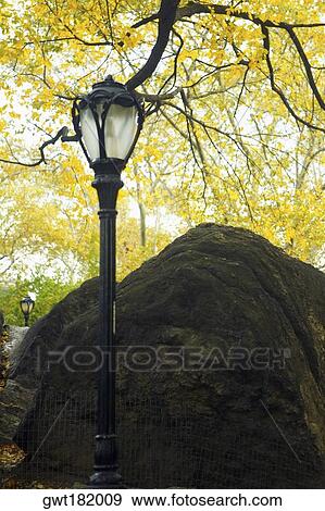 Low angle view of a lamppost near a boulder, Central Park, Manhattan, New York City, New York State, USA View Large Photo Image Stock Photo - Low angle view of a lamppost near a boulder, Central Park, Manhattan, New York City, New York State, USA. Fotosearch