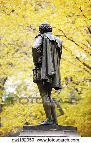 Stock Image - Low angle view of a statue on a pedestal, Central Park, Manhattan, New York City, New York State, USA. Fotosearch