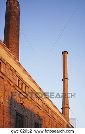 Low angle view of two smoke stacks, New York City, New York State, USA View Large Photo Image Stock Image - Low angle view of two smoke stacks, New York City, New York State, USA. Fotosearch