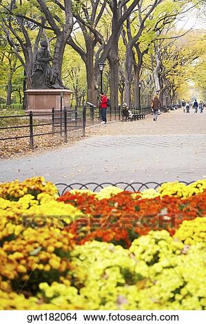 Statue on a pedestal in a park, Central Park, Manhattan, New York City, New York State, USA View Large Photo Image Picture - Statue on a pedestal in a park, Central Park, Manhattan, New York City, New York State, USA. Fotosearch