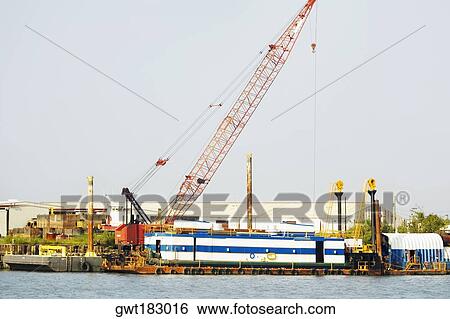 Crane at a commercial dock, Savannah, Georgia, USA View Large Photo Image Stock Photograph - Crane at a commercial dock, Savannah, Georgia, USA. Fotosearch