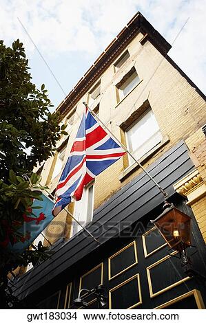 Low angle view of flags on a building, Savannah, Georgia, USA View Large Photo Image Picture - Low angle view of flags on a building, Savannah, Georgia, USA. Fotosearch