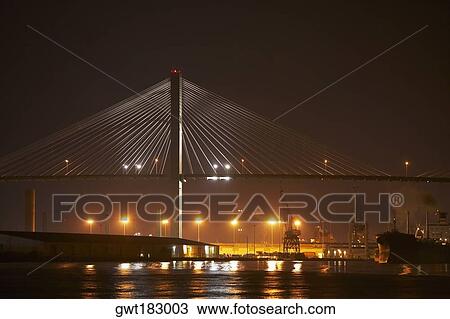 Stock Image - Suspension bridge lit up at night, Talmadge Bridge, Savannah River, Savannah, Georgia, USA. Fotosearch